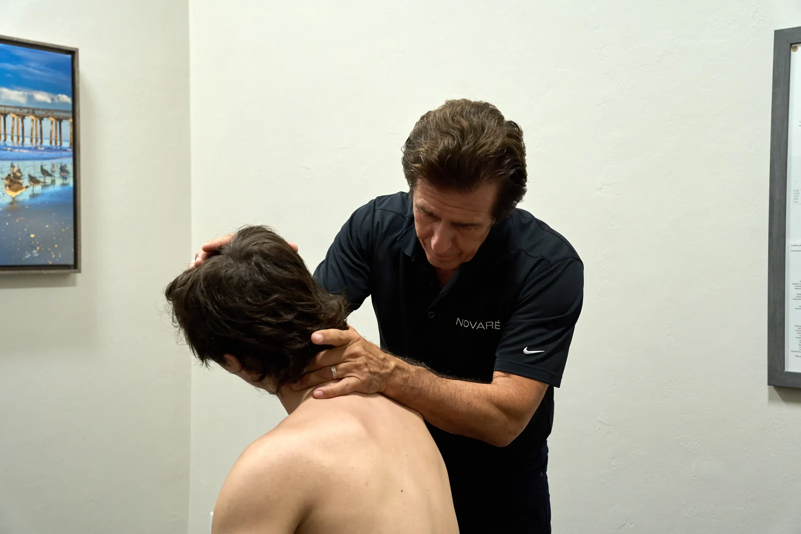 Dr. Ivan treating whiplash with manual therapy