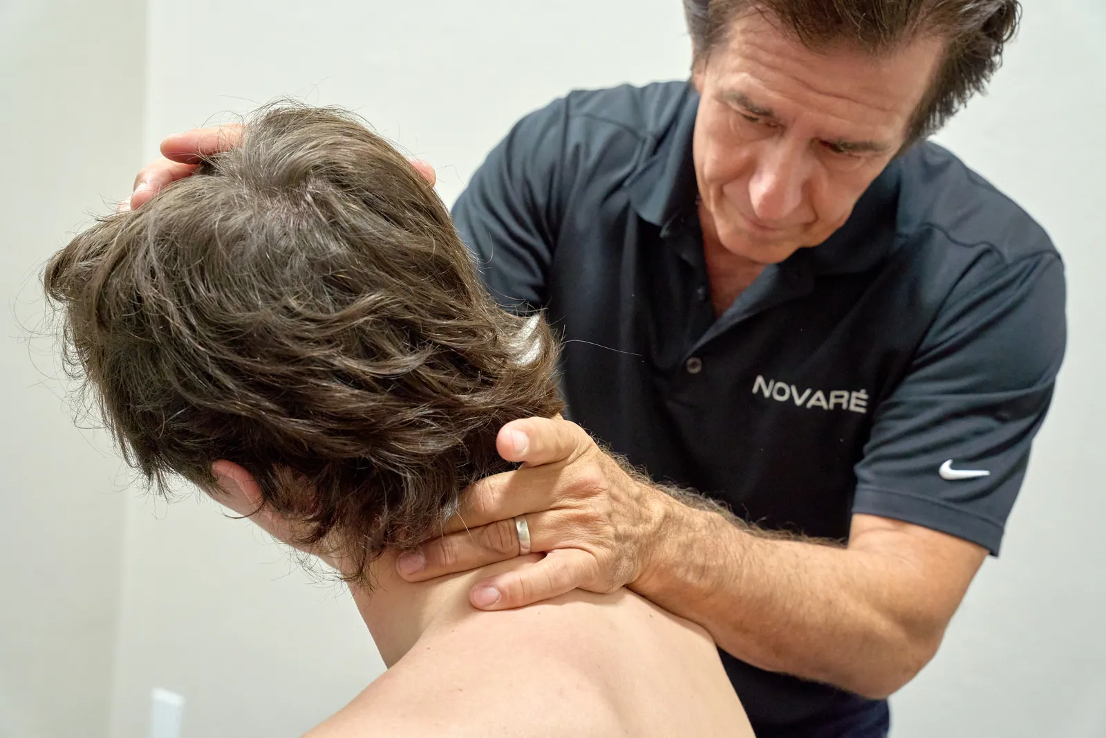 Dr. Ivan performing chiropractic evaluation at Novaré Injury Care