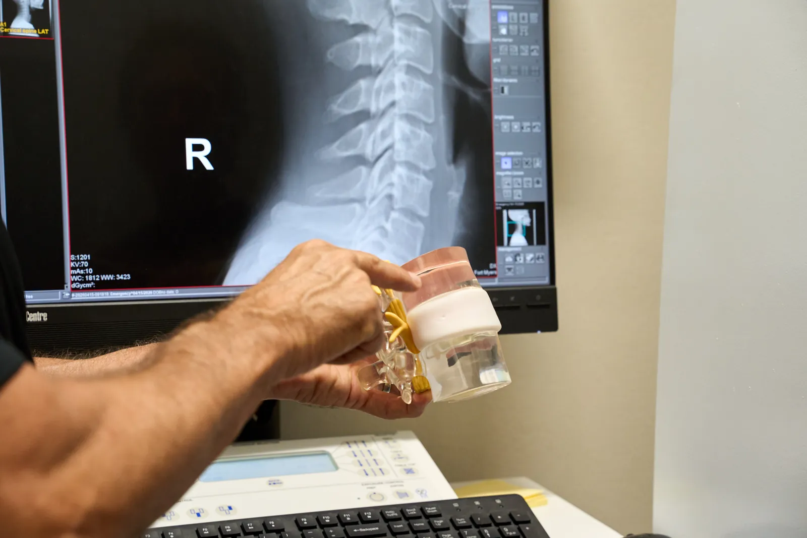 Dr. Ivan presenting treatment rooms at Novaré Injury Care