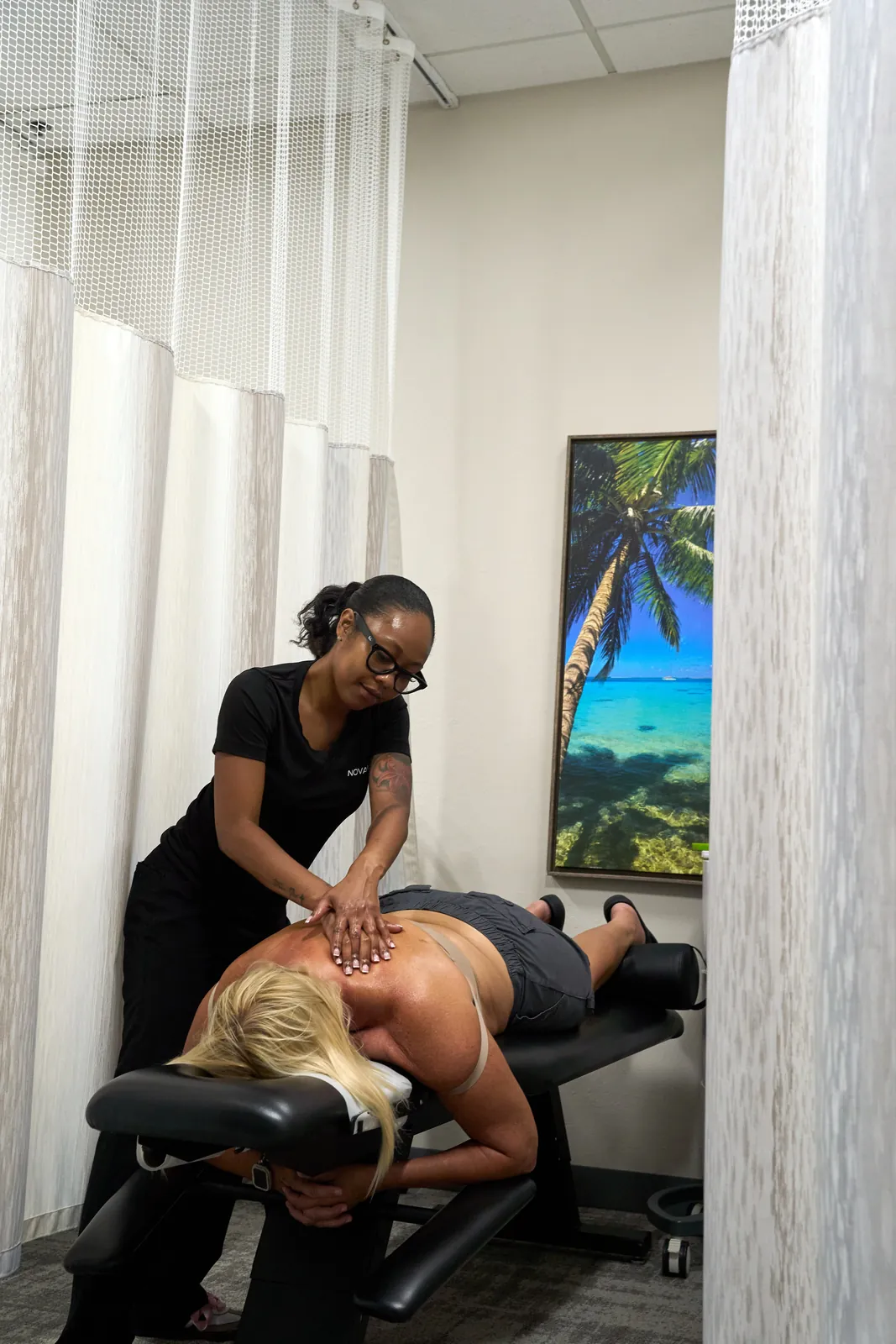 Manual treatment of the neck and shoulder for a pinched nerve at Novaré Injury Care in Fort Myers