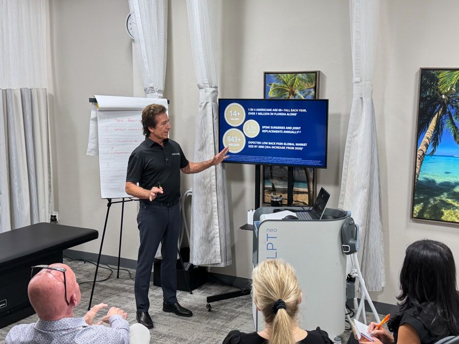 Dr. Ivan Bracic presenting EMSCULPT NEO functional wellness therapy research at Novaré Injury Care